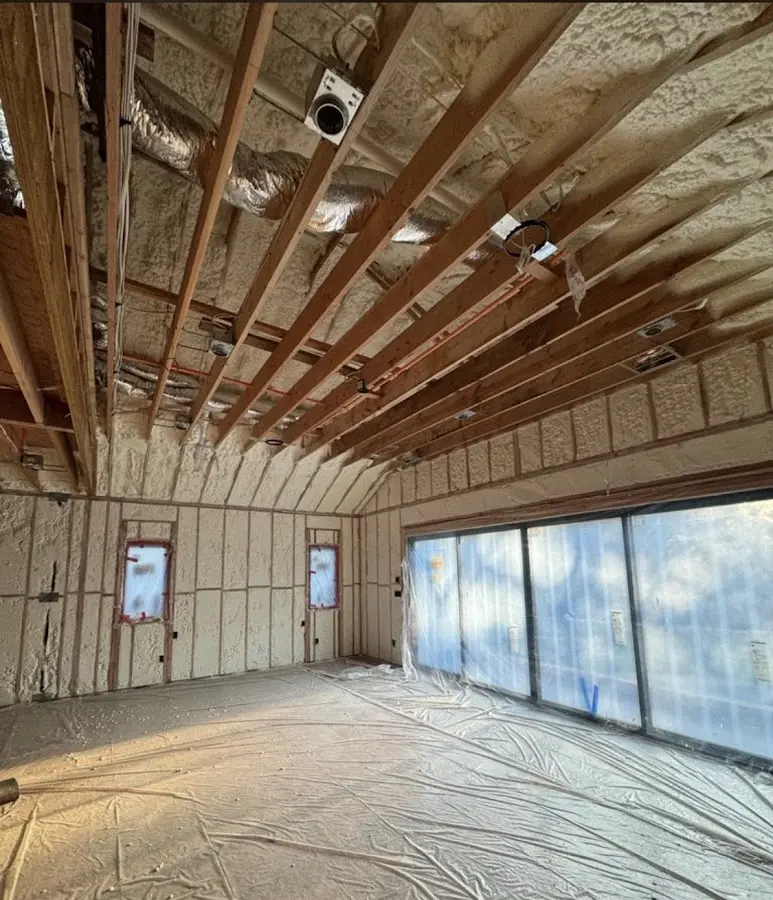 Interior walls and ceiling insulated with spray foam during new construction in Forest Hills